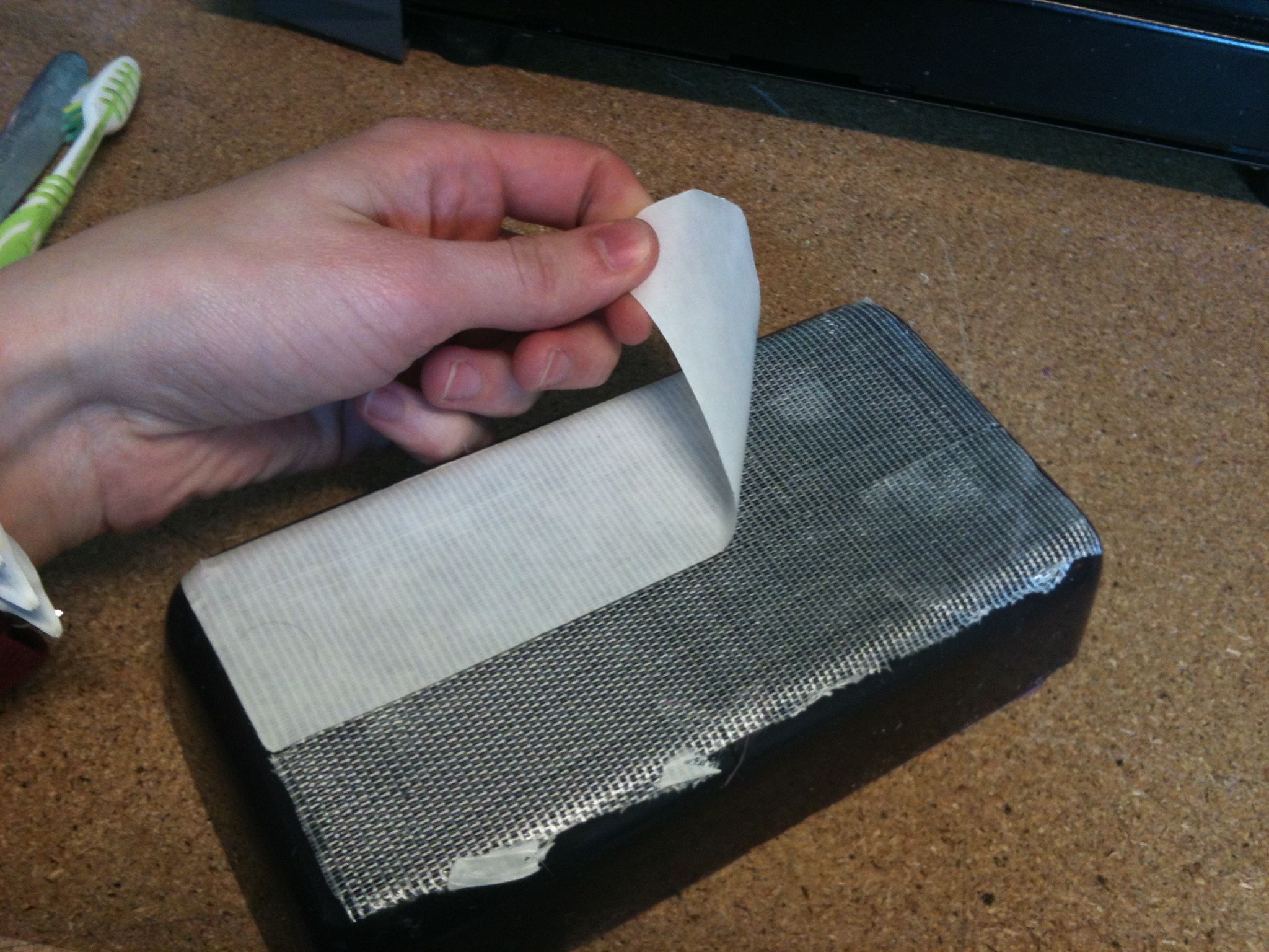 taping the wax in place