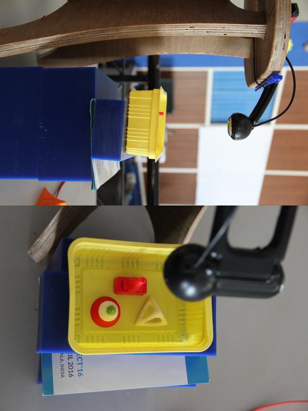 Two different views of our scanner. You can see mounted camera and the objects placed for scanning 