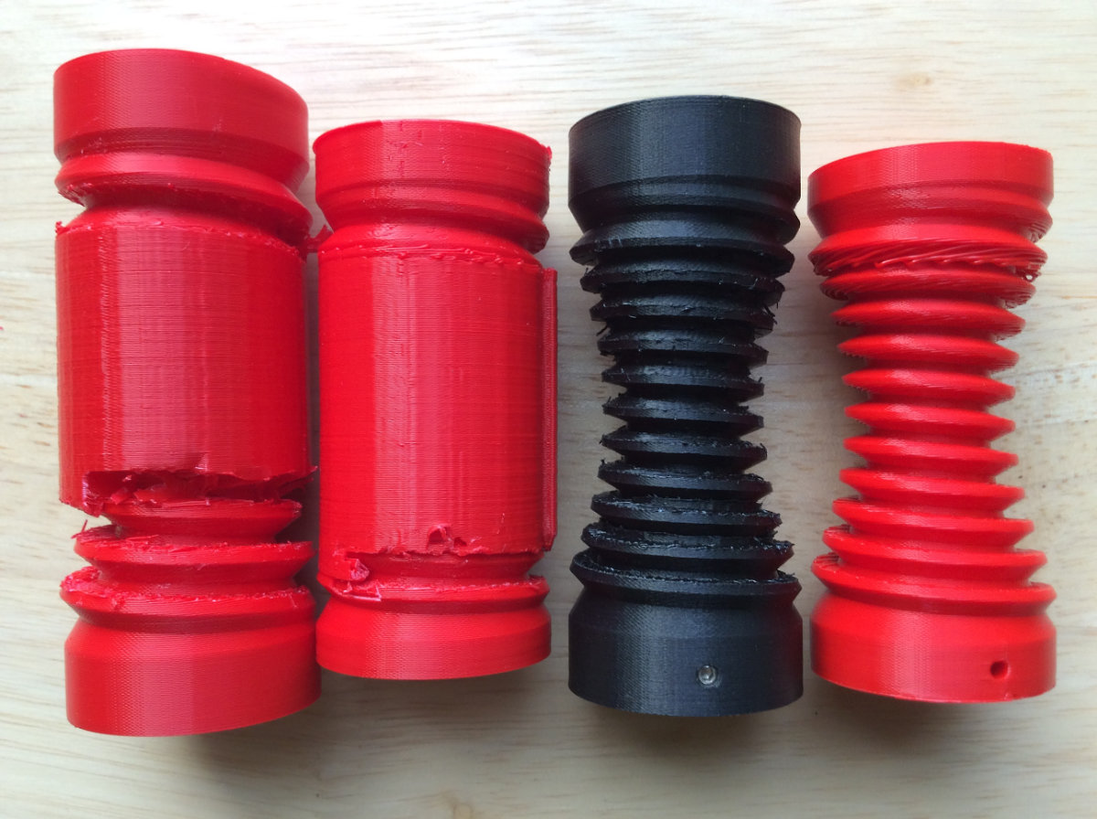 Different Globoid Worm Gears. This shows that all prints had a problem. The first two shows failed attemps at removing the supports without marring the gear profile, the black one was a success at removing the support but need sanding of all the surfaces, the last one on the right was done without any support but shows the drooping on the upper part of the gear, rendering it useless.