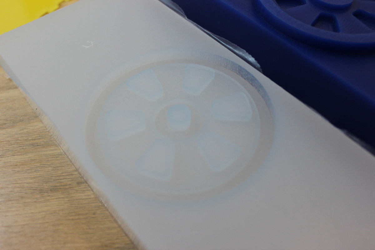 The silicone mold beside the machinable wax original