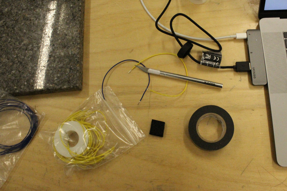 An X-Acto knife, two wires, a foam pad and some electrical tape: this is our sensor!