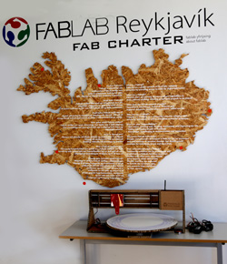 Photo of the Mandala Machine under a the logo of Fab Lab Reykjavík and Iceland 