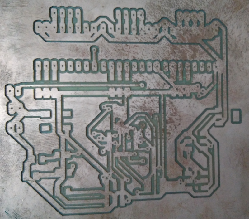 The milled board. You can see the traces are no milled properly